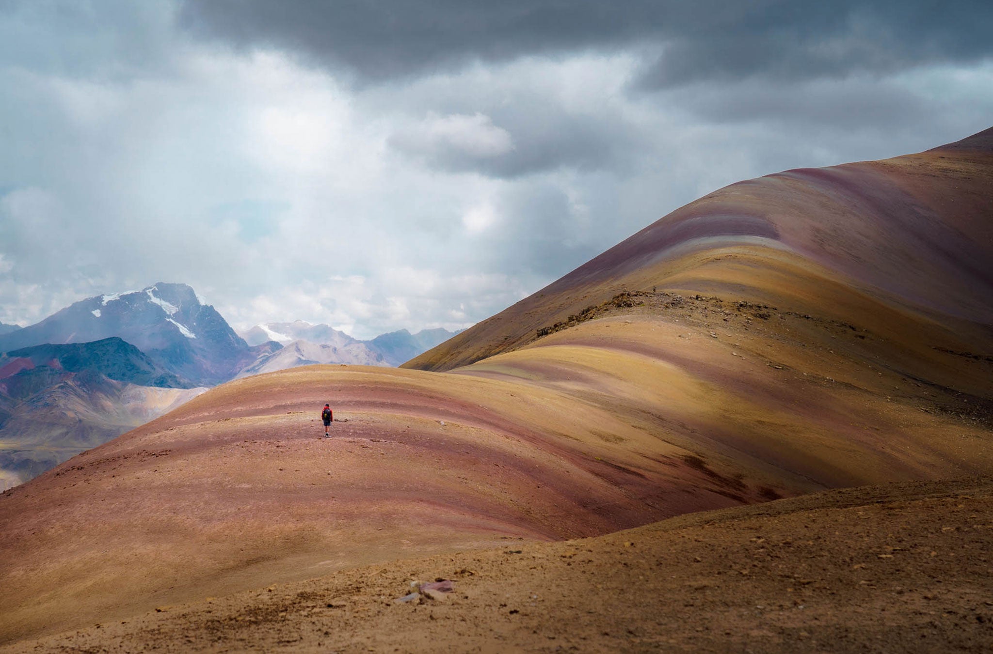 Large rounded mountain with gradient soil colors