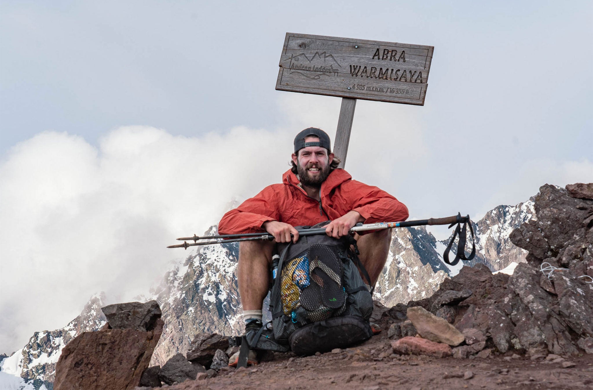 Hiker at summit of Abra Warmisaya