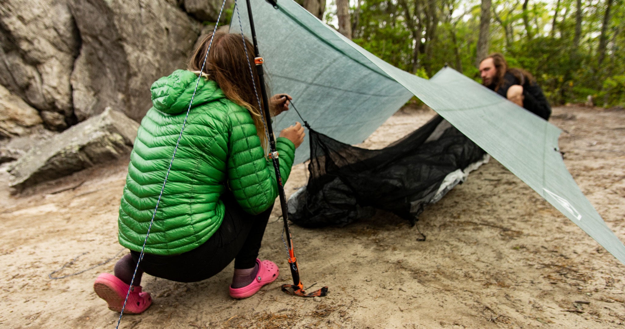 Ultralight backpackers setting up tent