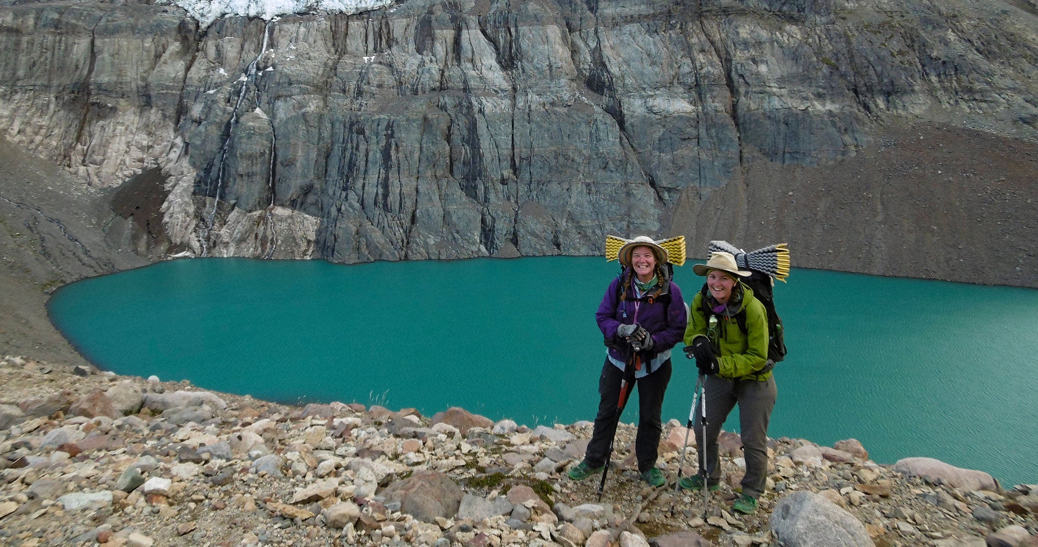 Ultralight Backpackers in front of a mountain lake