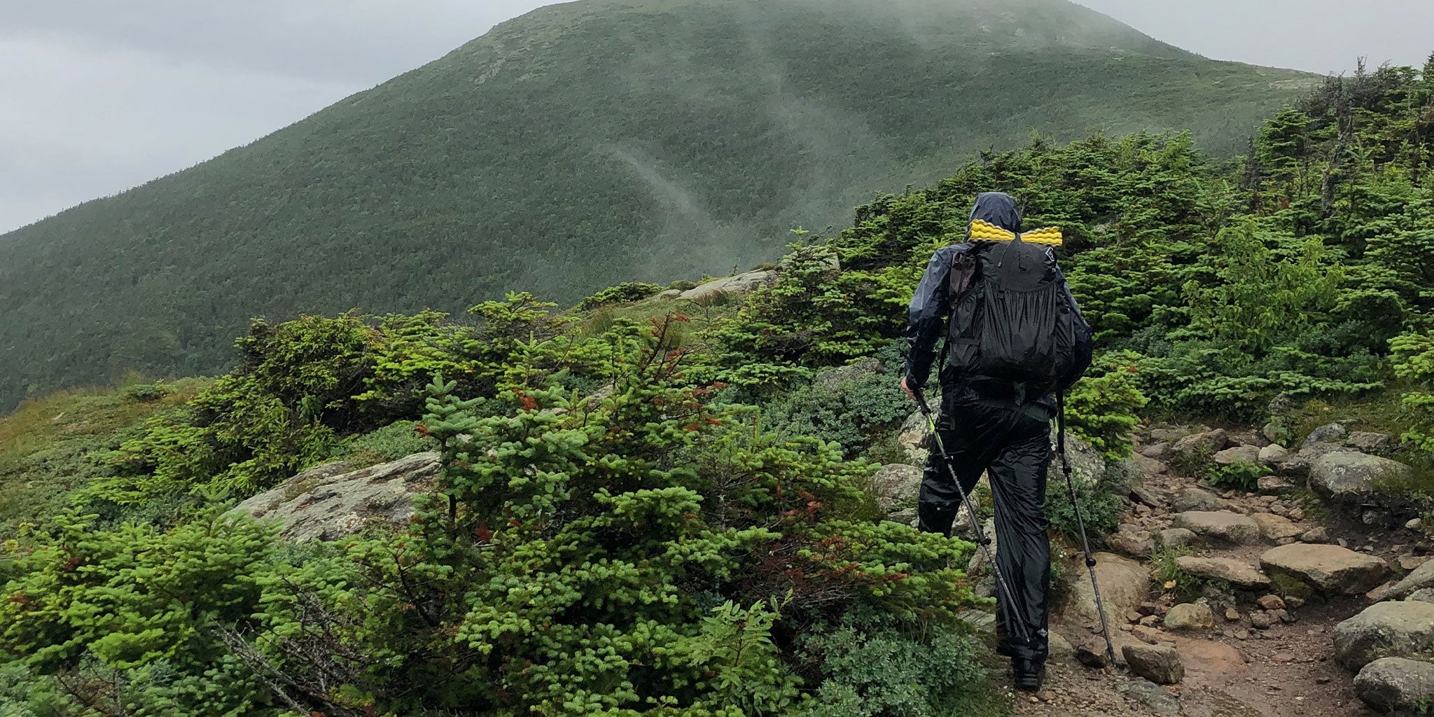 Rainy ascent for a hiker