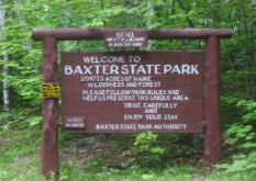 Wooden sign for Baxter State Park in Maine