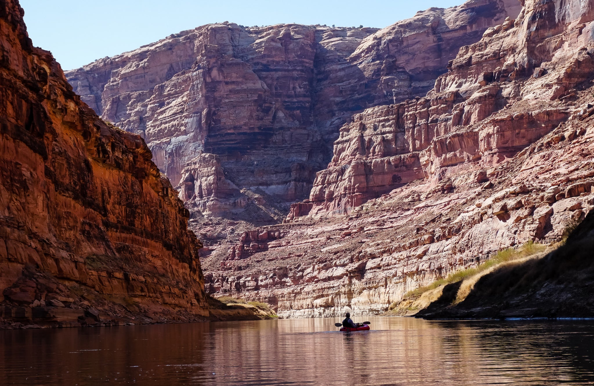 Paddler rafts down the Colorado river