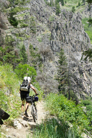 Ultralight bikepacking next to cliff