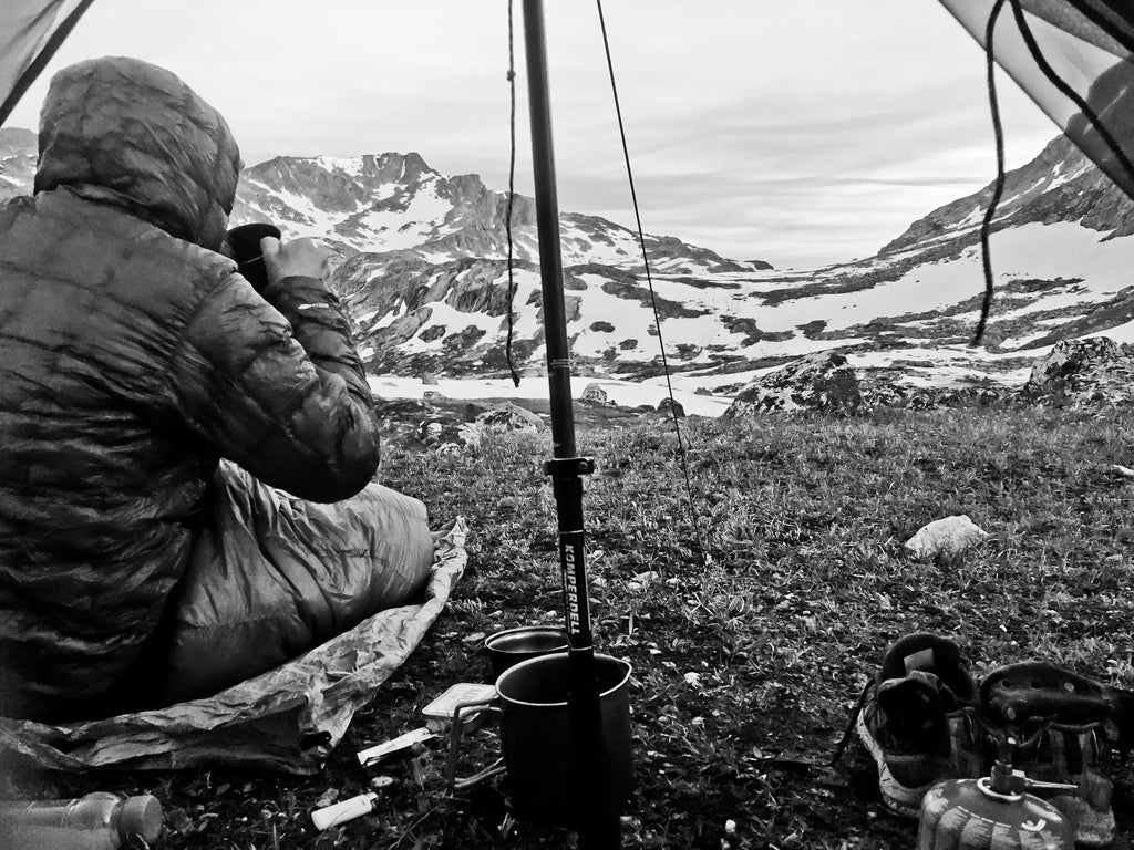 Ultralight backpacker enjoying a view from a tent