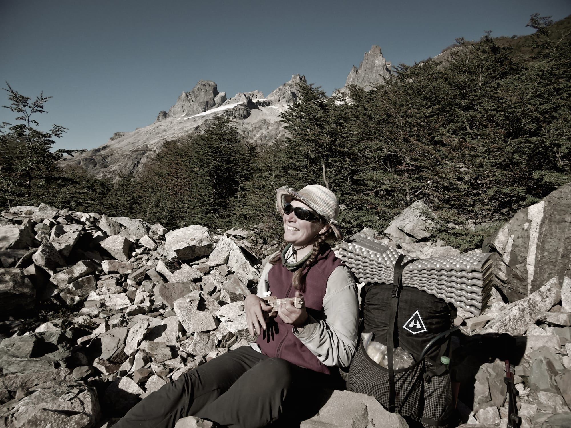 Ultralight Backpacker Bethany Hughes playing the ukulele in the backcountry