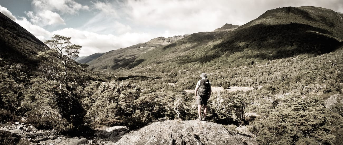 Ultralight Backpackers looking over a sprawling mountain scene