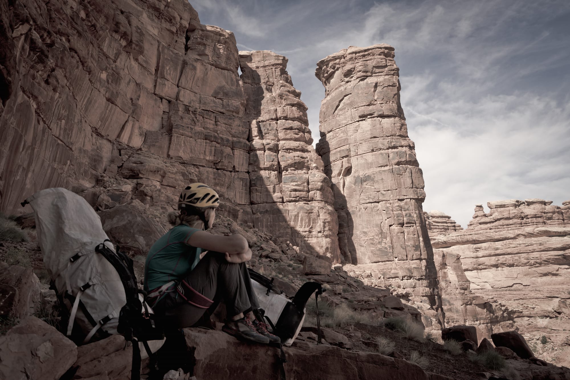 climber looking at red rock route