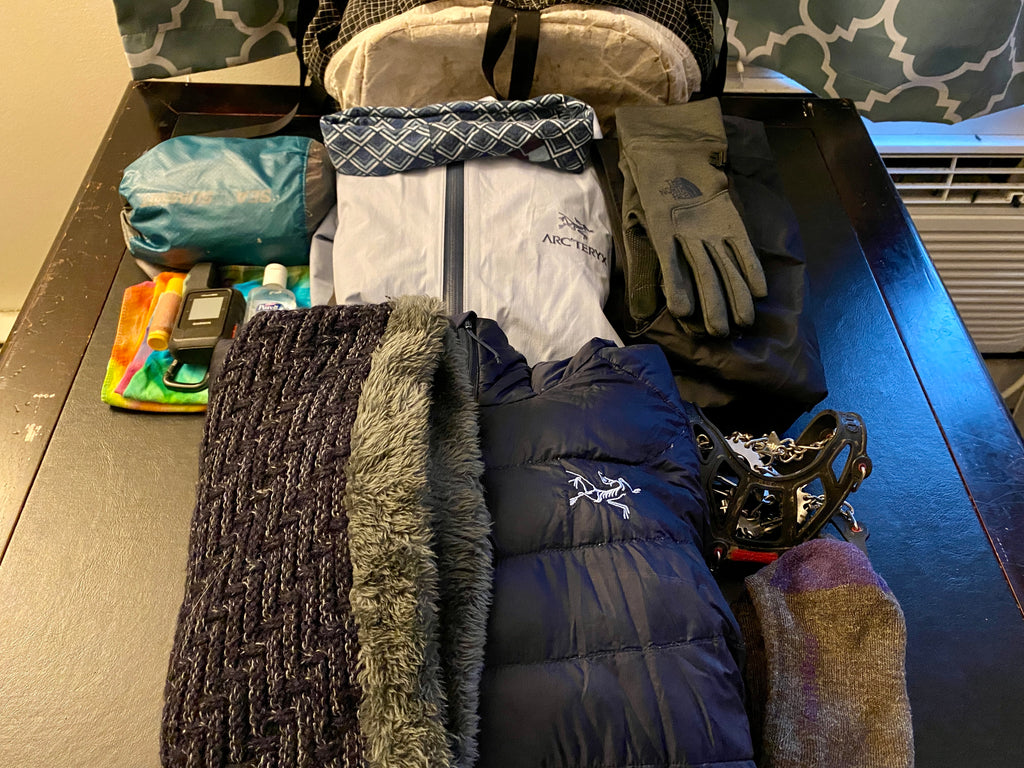 Trip gear laid out for packing
