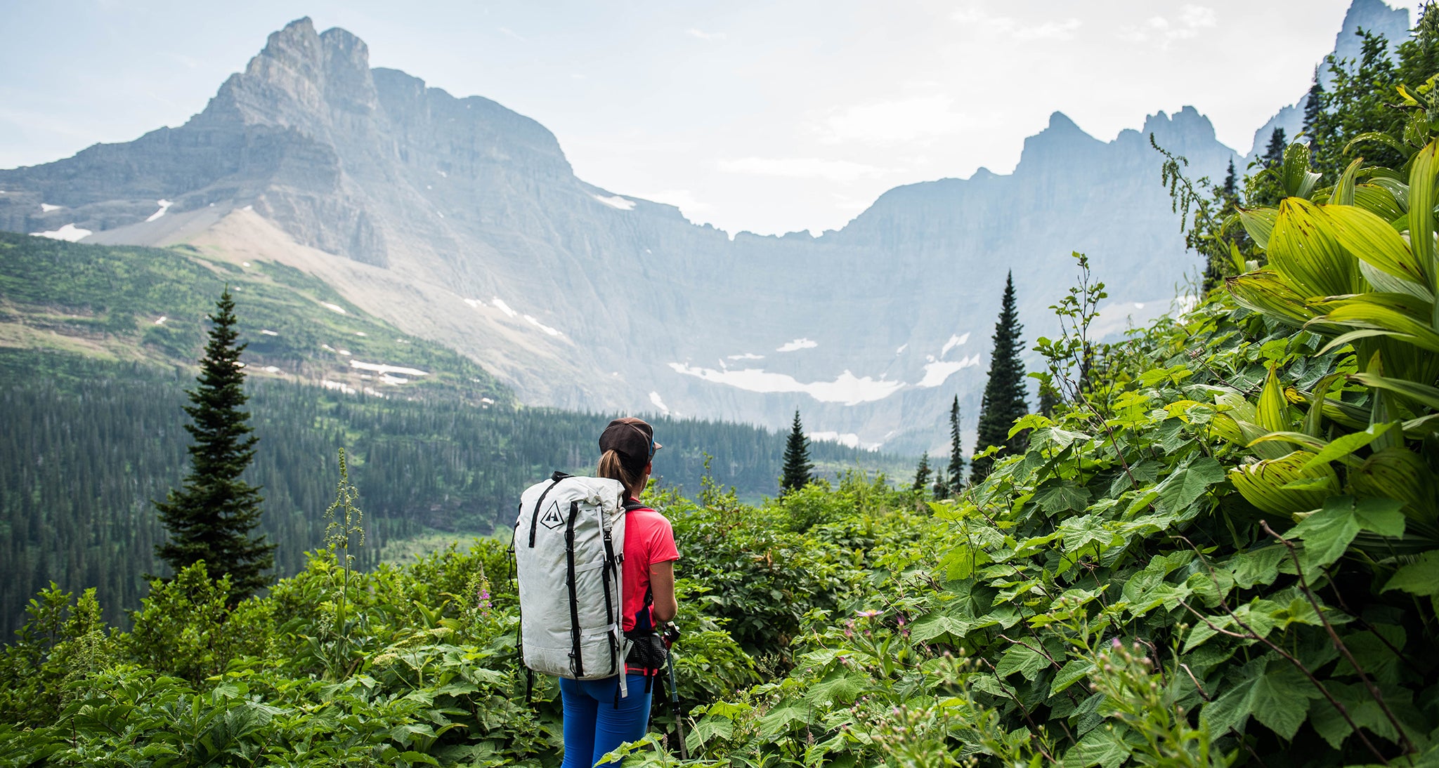 Ultralight hiker gazes at the large mountains ahead