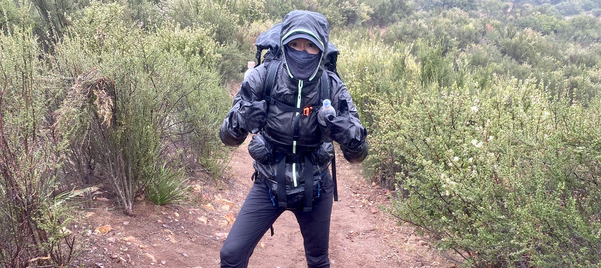 Hiker bundled up to beat the rain