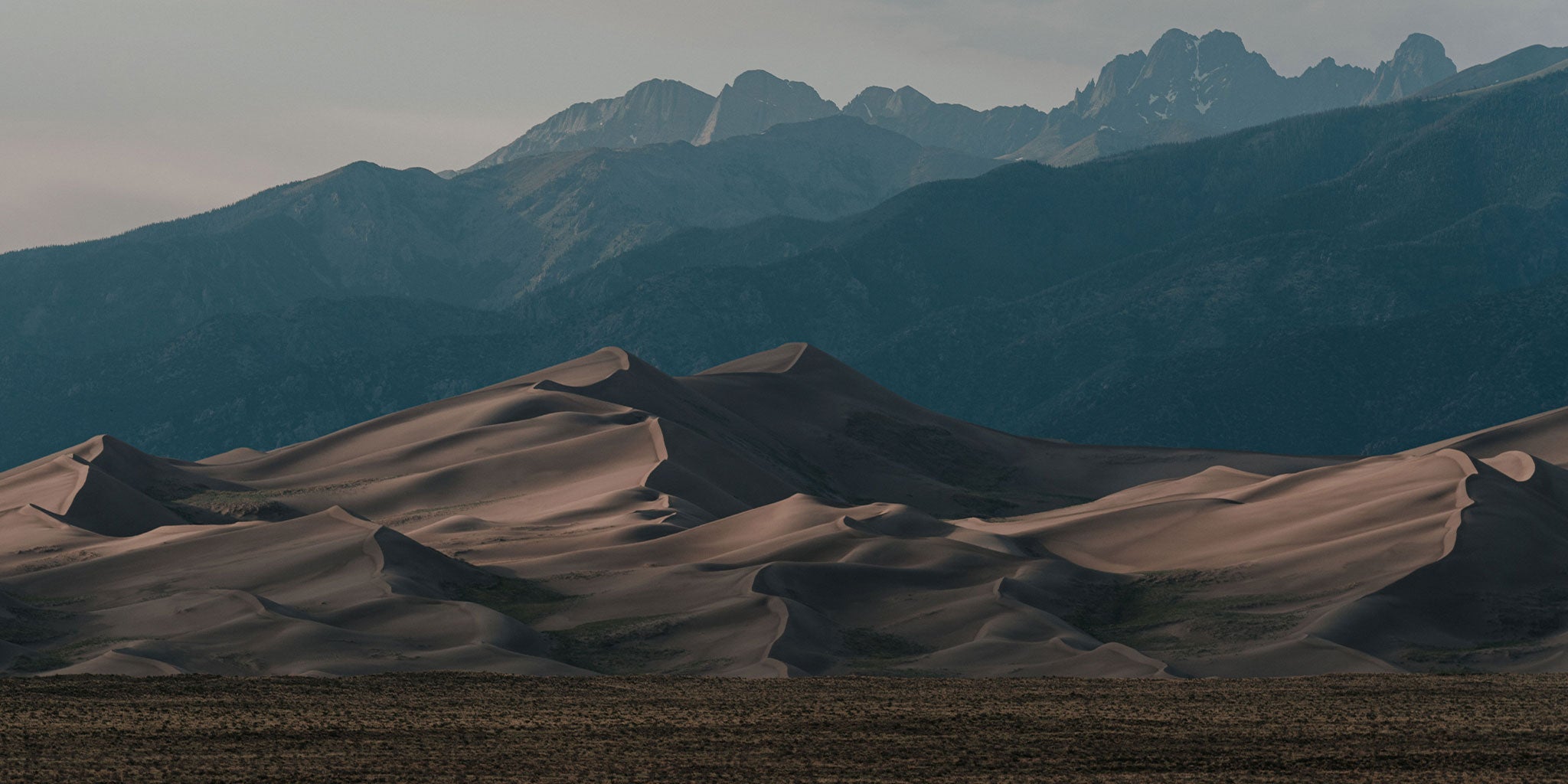 The Great Sand Dunes with a mountainous backdrop