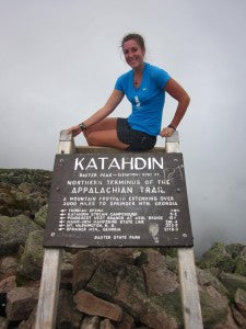 Thru Hiker poses at peak of Katahdin