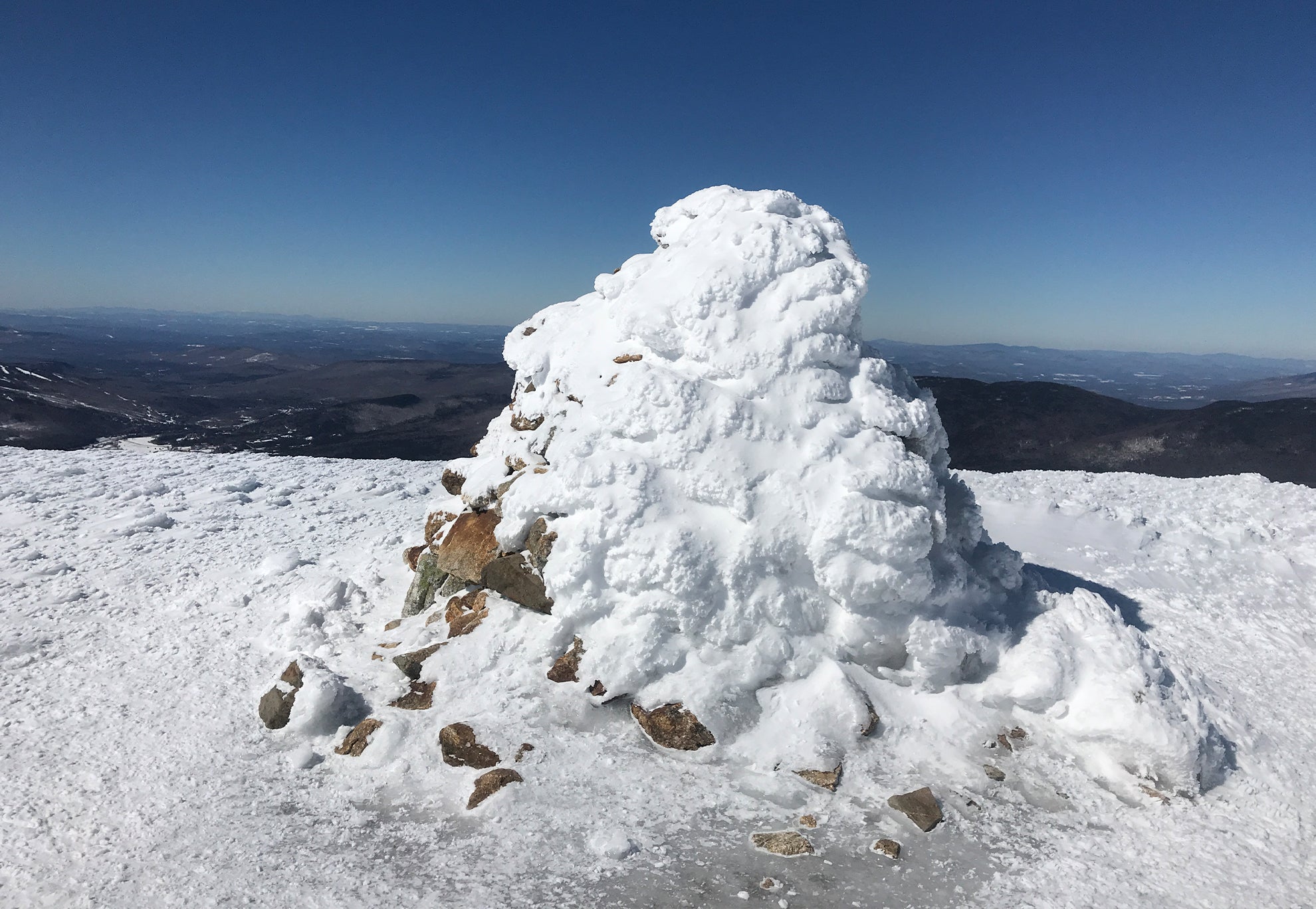 Large snow covered cairn
