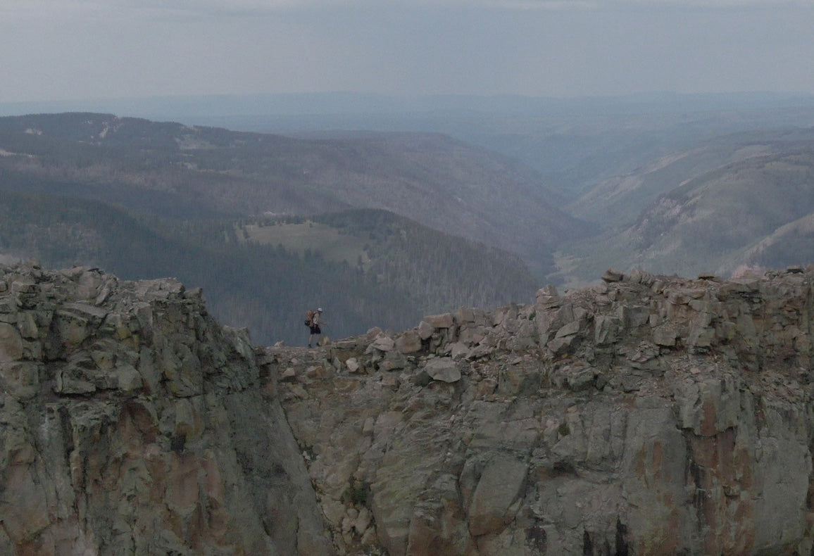 Hiker traverses razor thin ridge