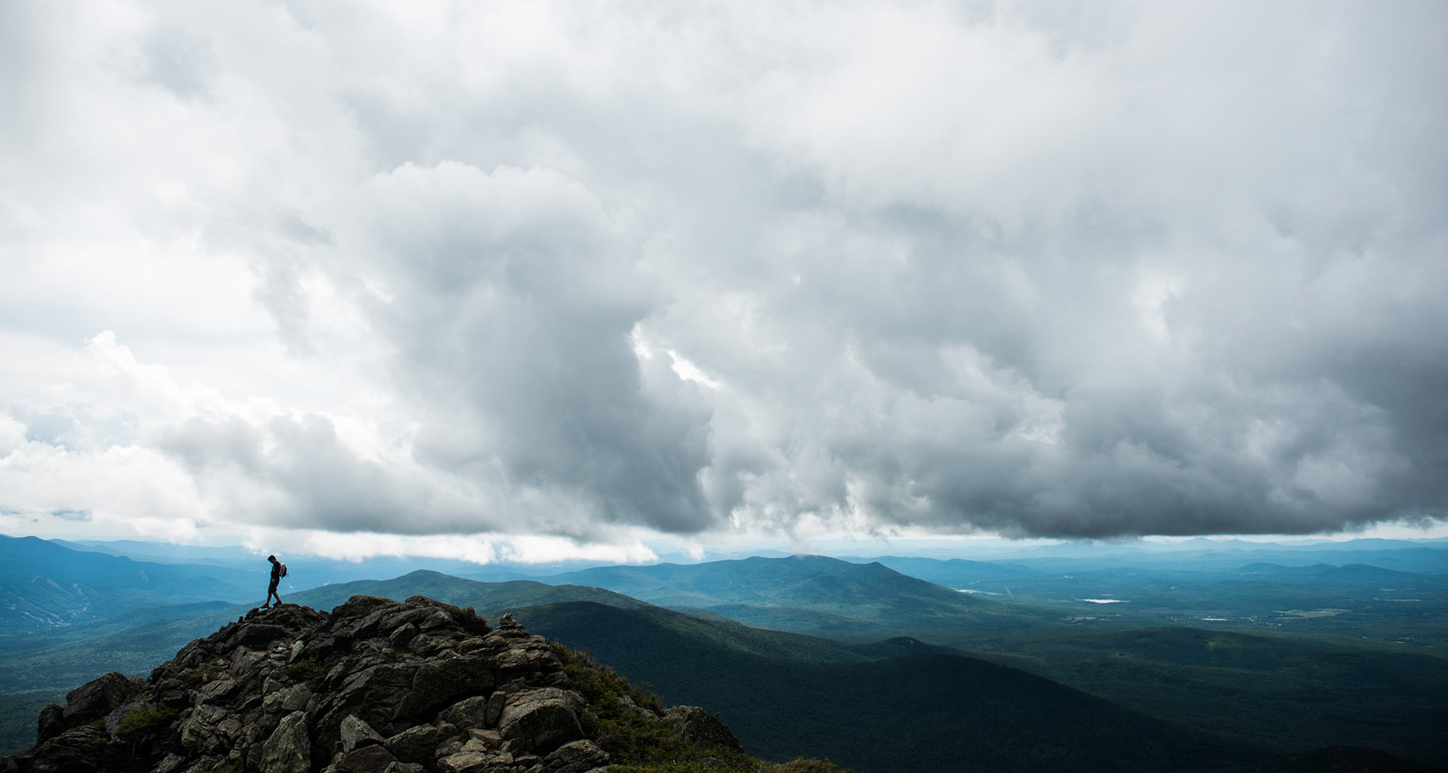 Hiker makes it to the summit on a cloudy day