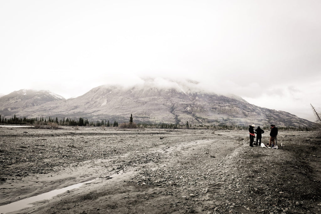 Ultralight bikepackers consulting a map