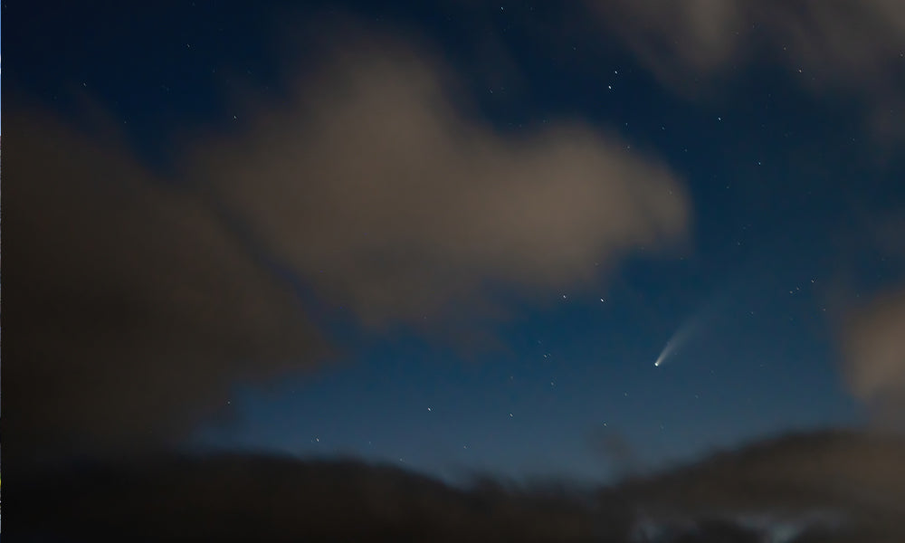 The Neowise Comet, quickly poking through the clouds.