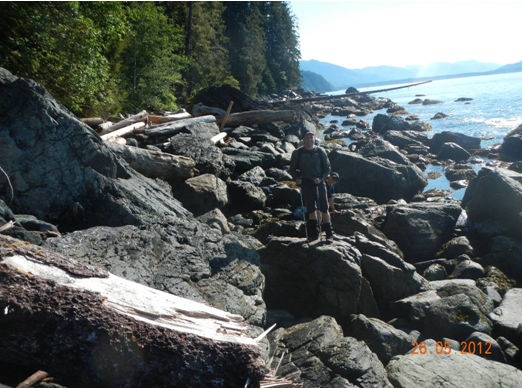 Ultralight backpacker on rocky beach