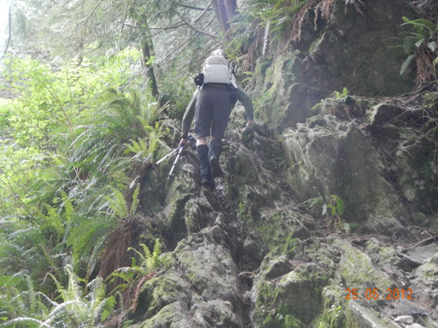 Ultralight backpacker hiking over rocks