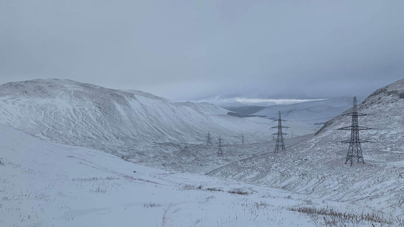 Snow covered mountains and valleys