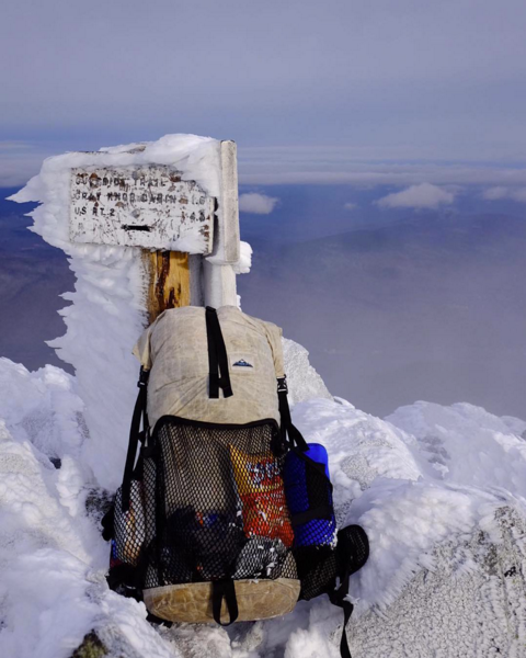 Photo of ultralight backpack at the peak of mountain