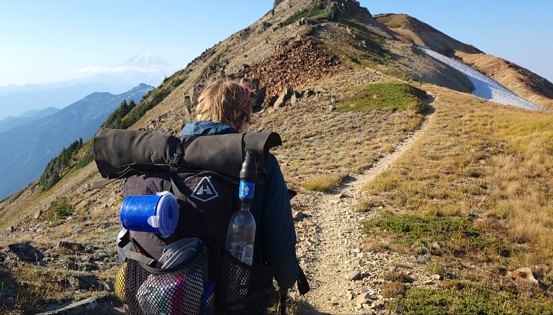 Ultralight backpacker approaches the summit