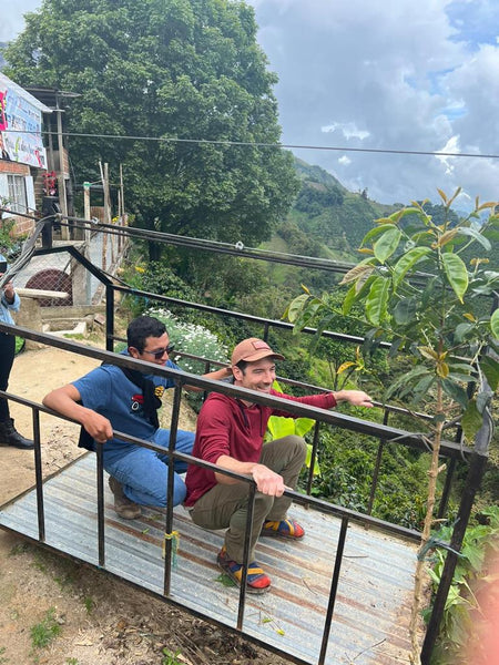 Scott on the pulley system platform over the coffee fields of Colombia.