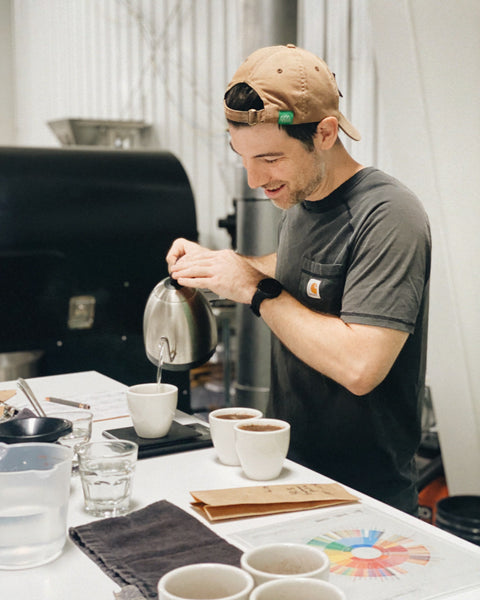 Aldea's head coffee roaster, Scott, cupping coffees