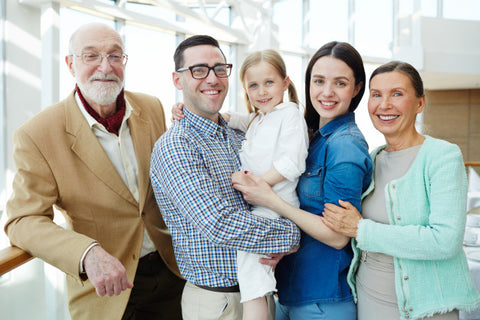 Healthy family in a bright room. Designs for Health has high-quality supplements for every stage of life