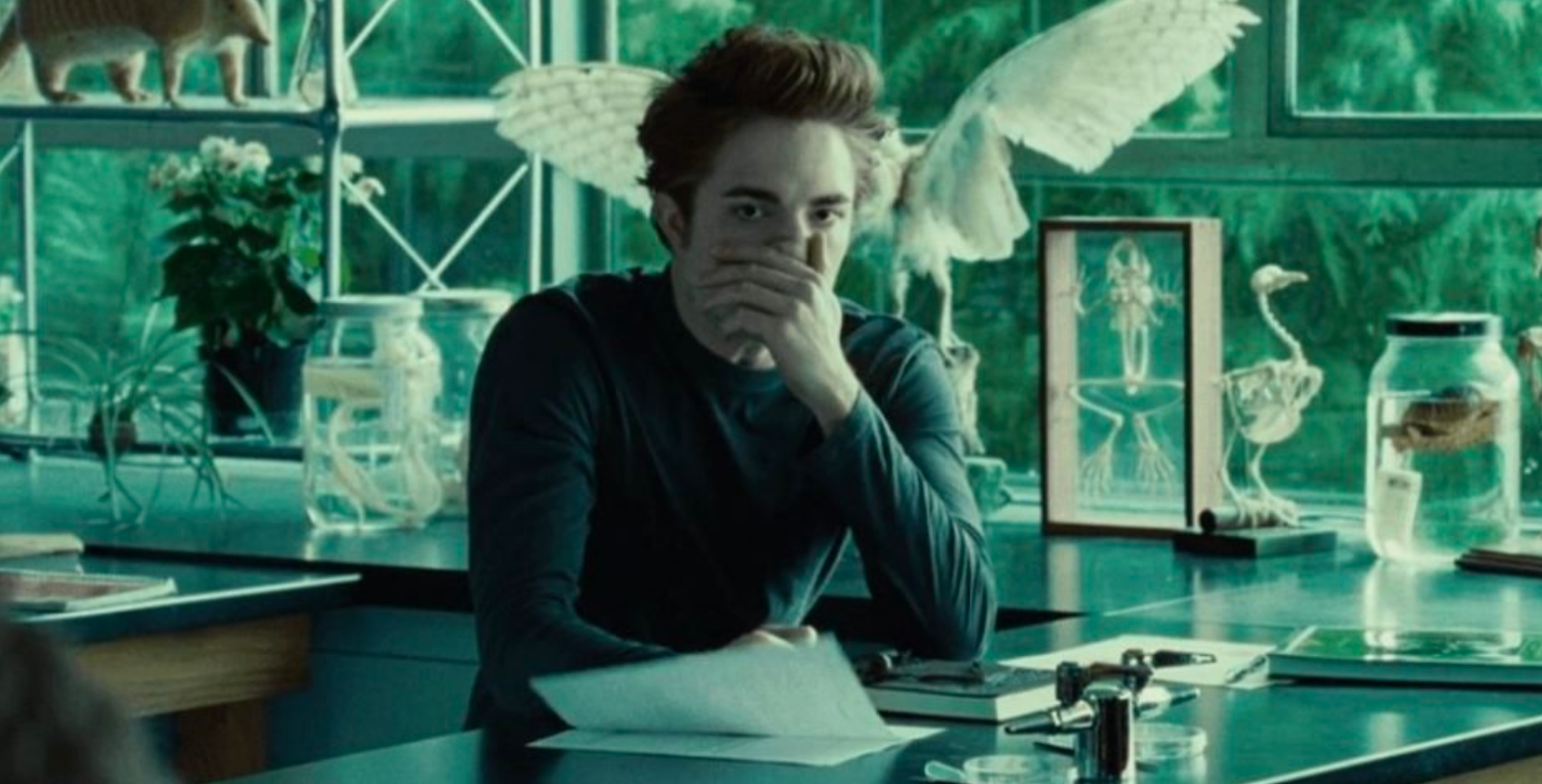 Image: Edward covering his nose in biology class because he smells Bella