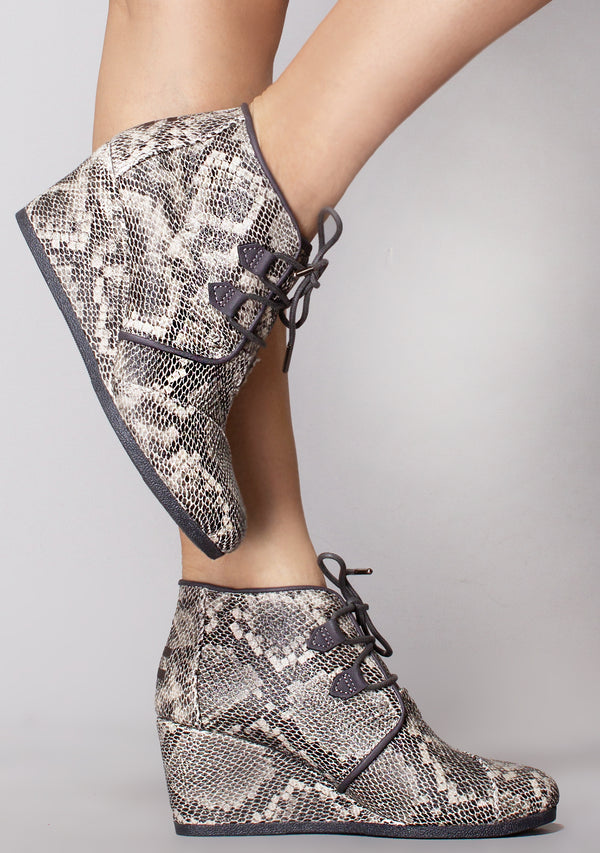 snakeskin wedge booties