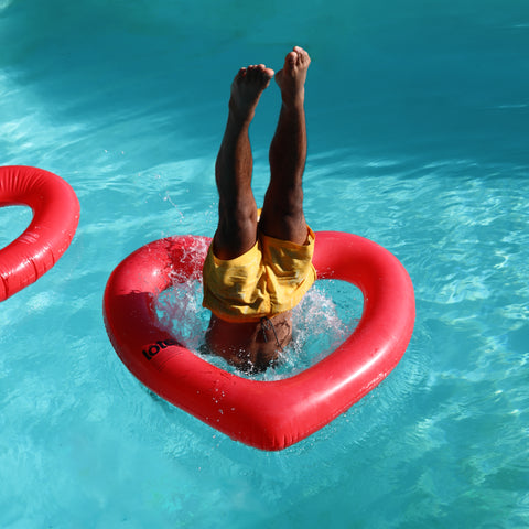 Guy diving into Red Heart Float