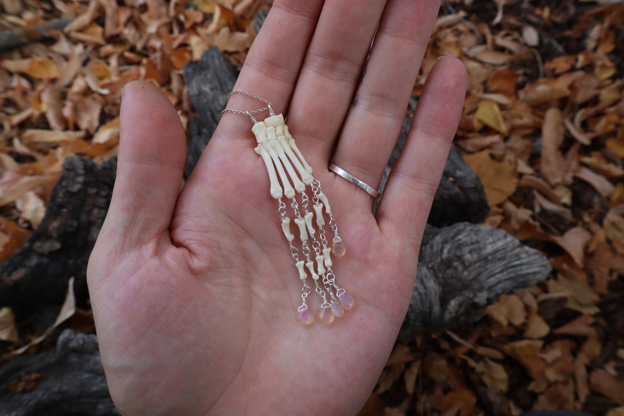Fluid Striped Skunk Paw Articulation Necklace with Opal “Claws”