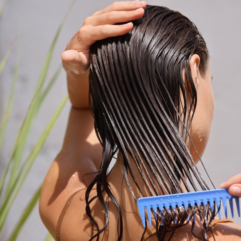 girls combing through hair