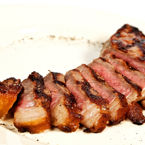 close-up view of sliced, cooked brisket to show how long to let brisket rest