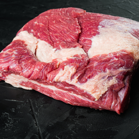 closeup view of raw brisket showing fat marbling throughout