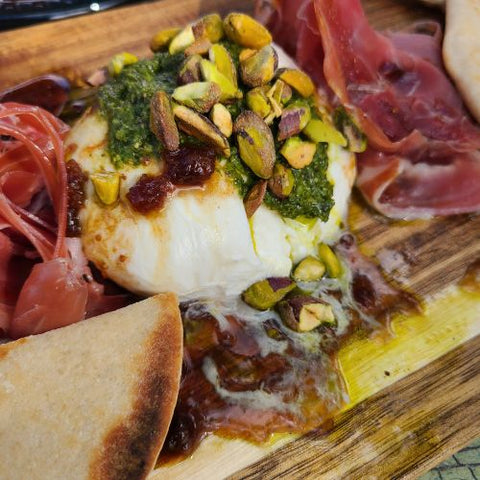 vegetarian charcuterie with mozzarella cheese and topped with pistachios
