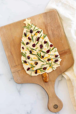 butter board with christmas tree shape spread