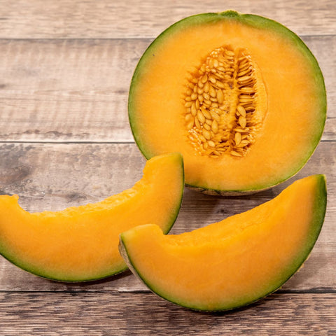 how to cut a cantaloupe - cut it in half and remove seeds