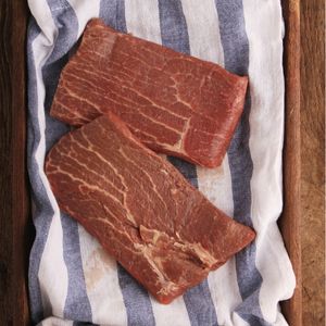 top view of two raw patio steaks on top of a towel