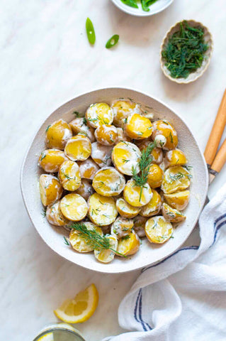 potato salad with dill in a dish