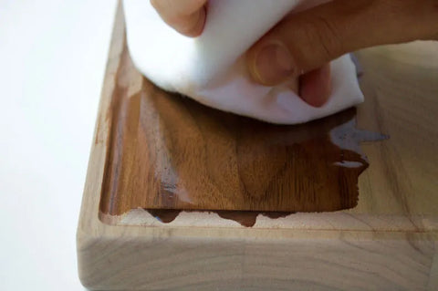 rub seasoning oil into a cutting board to season it and hydrate the wood fibers