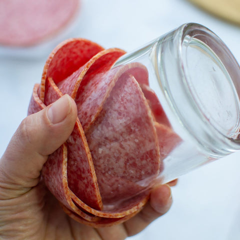 glass inverted after the salami pieces are placed on top