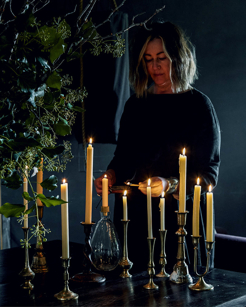 Tania Robinson lighting beeswax candles at the Southern Wild Co Shedquarters