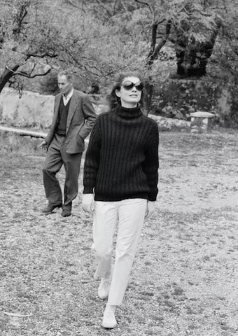 Jackie Kennedy wears a rollneck knit