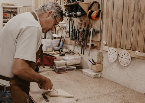 Peter from Winestains marking a circle on raw timber