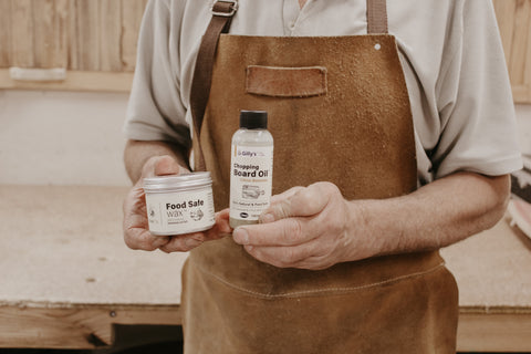 Peter from Winestains holding Gilly's Food Safe Wax and Chopping Board Oil