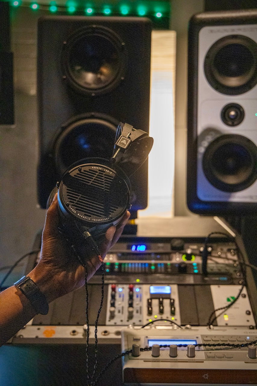 Patrick holding Audeze LCD-X headphones in studio