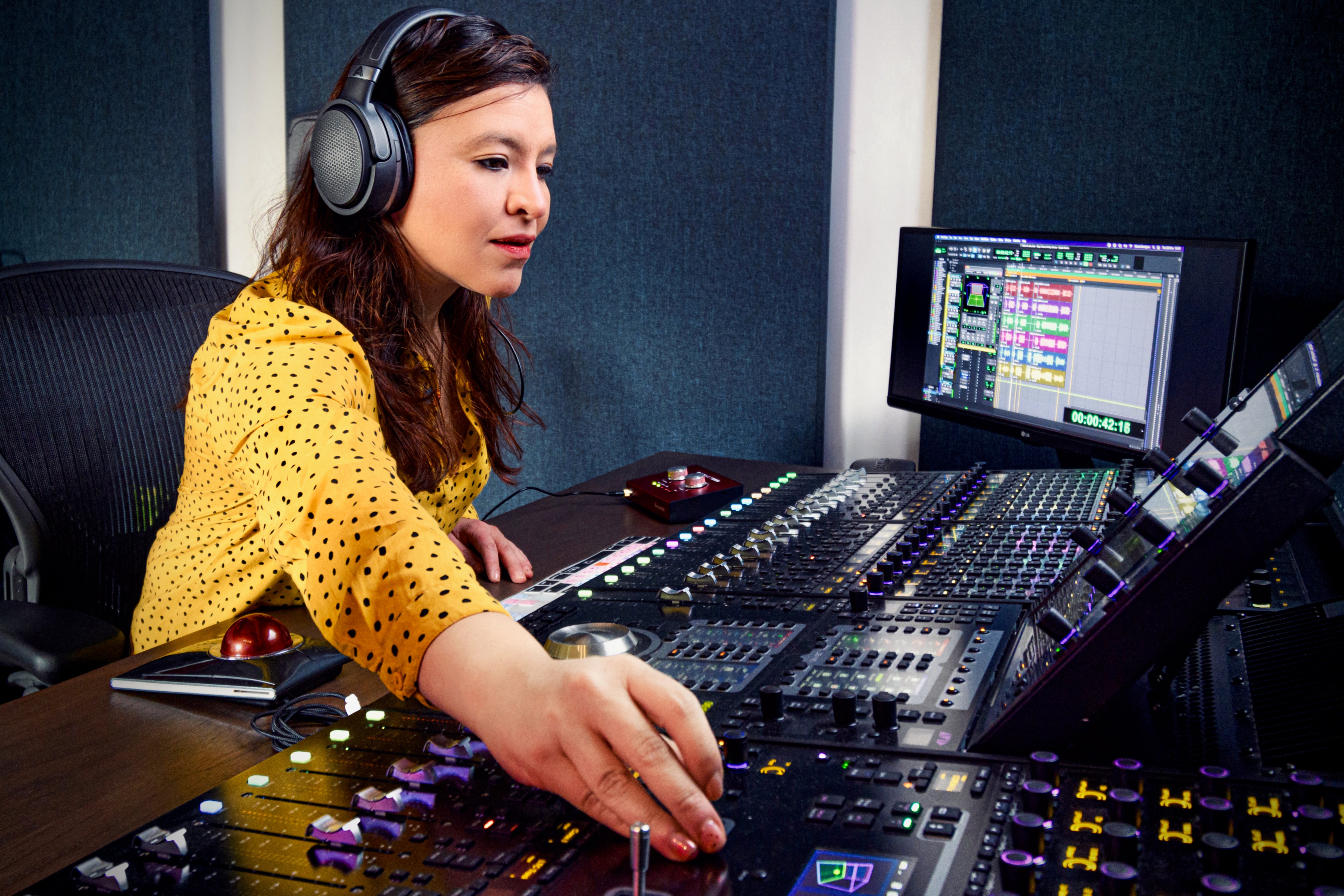 Carolina Antón mixes using her Audeze Mobius headphones